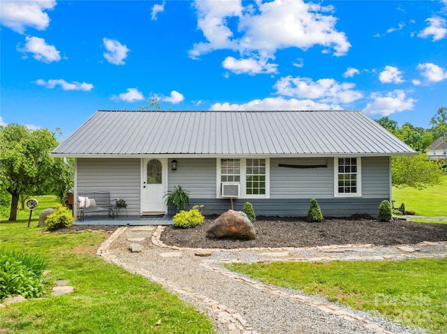 16 Julep Dr, Alexander, NC 28701 - ranch-style house with metal roof, covered porch, and a front lawn