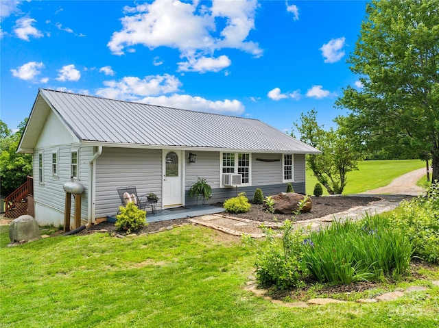 16 Julep Dr, Alexander, NC 28701 - ranch-style house with a front lawn, metal roof, cooling unit, and covered porch