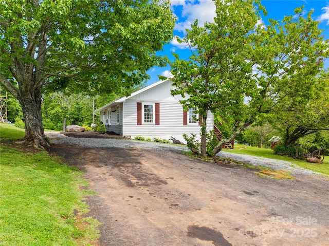 16 Julep Dr, Alexander, NC 28701 - view of front of property with dirt driveway and a front lawn