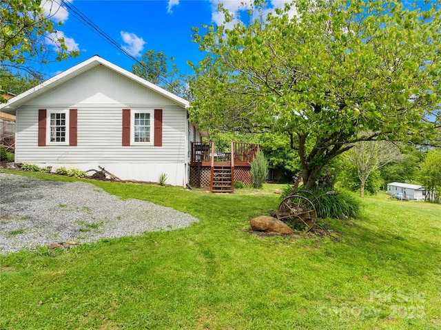 16 Julep Dr, Alexander, NC 28701 - view of home's exterior featuring a wooden deck, a lawn, and stairs