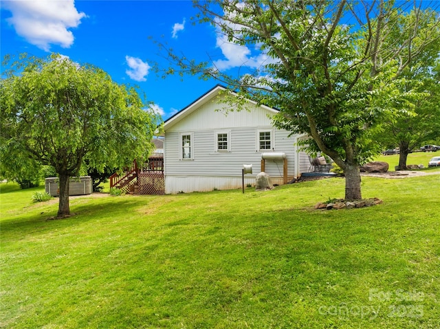 16 Julep Dr, Alexander, NC 28701 - view of side of home featuring a deck, stairs, and a lawn