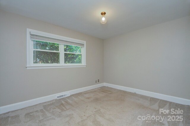 3951 Whitehall Dr, Charlotte, NC 28208 - carpeted empty room featuring baseboards