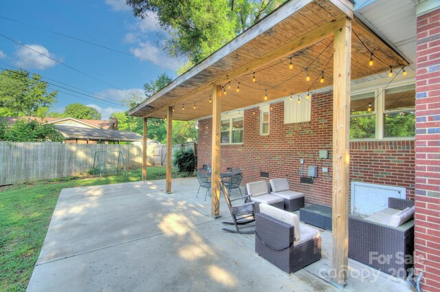 3951 Whitehall Dr, Charlotte, NC 28208 - view of patio / terrace with a fenced backyard and an outdoor hangout area