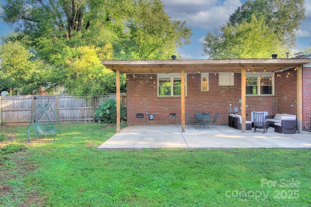 3951 Whitehall Dr, Charlotte, NC 28208 - back of house featuring brick siding, a patio area, and crawl space