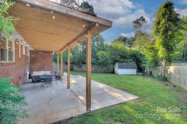 3951 Whitehall Dr, Charlotte, NC 28208 - view of patio / terrace featuring outdoor lounge area, a shed, and an outbuilding