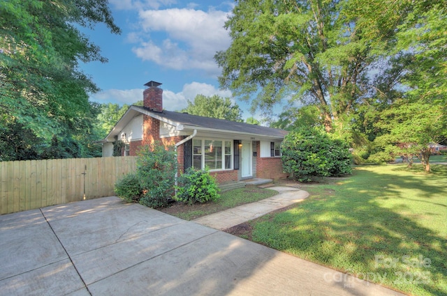 3951 Whitehall Dr, Charlotte, NC 28208 - view of front of property featuring brick siding and a chimney