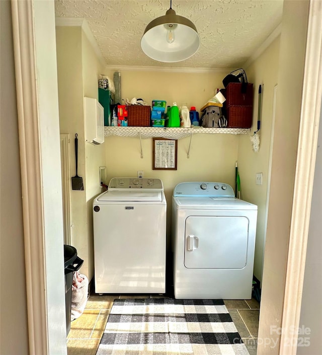 49 Perseverance Dr, Canton, NC 28716 - laundry room with washing machine and clothes dryer, a textured ceiling, and ornamental molding