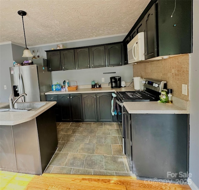 49 Perseverance Dr, Canton, NC 28716 - kitchen with appliances with stainless steel finishes, a sink, a textured ceiling, light countertops, and crown molding