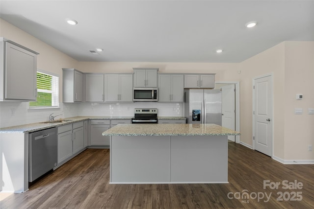 383 Ridgeview Ln, Mars Hill, NC 28754 - kitchen with appliances with stainless steel finishes, gray cabinetry, a center island, tasteful backsplash, and recessed lighting