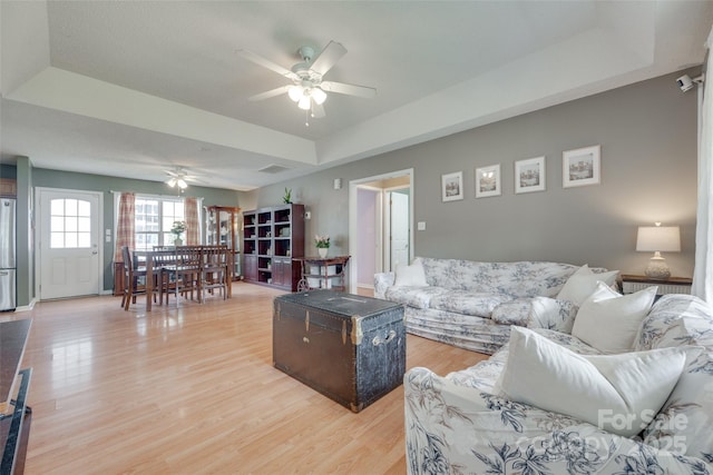 2023 E Park Dr, Lancaster, SC 29720 - living area with a tray ceiling, a ceiling fan, and light wood-style flooring