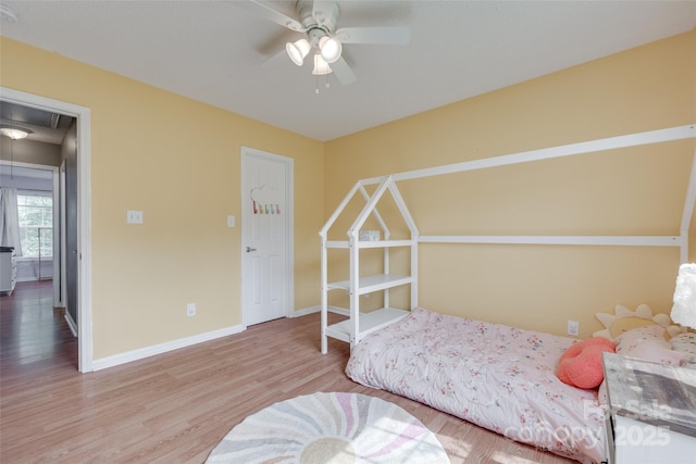 2023 E Park Dr, Lancaster, SC 29720 - bedroom with attic access, wood finished floors, baseboards, and a ceiling fan