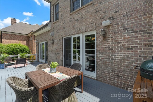 6132 Sharon Rd, Charlotte, NC 28210 - wooden terrace with outdoor dining space and grilling area