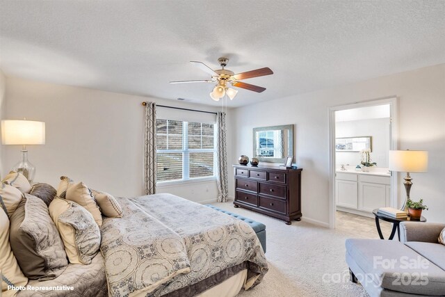 3735 13th St NE, Hickory, NC 28601 - bedroom with light colored carpet, a textured ceiling, ensuite bathroom, baseboards, and ceiling fan