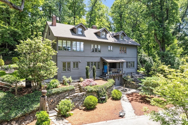 66 Fox Trot Ln, Tryon, NC 28782 - view of front of property with a chimney, stairs, and view of wooded area