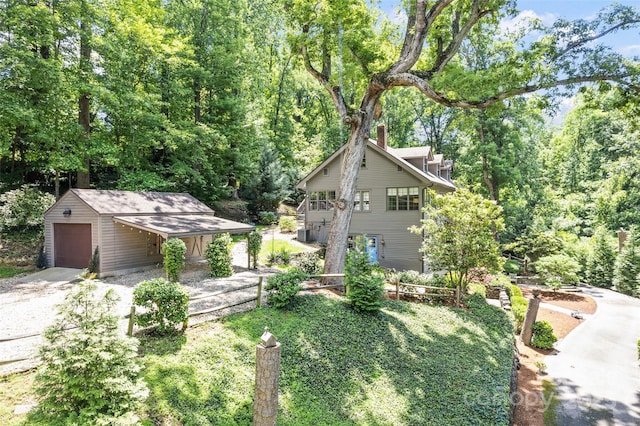 66 Fox Trot Ln, Tryon, NC 28782 - view of front of home with an outbuilding, a chimney, and driveway