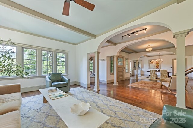 66 Fox Trot Ln, Tryon, NC 28782 - living area featuring wood finished floors, a ceiling fan, arched walkways, and ornate columns