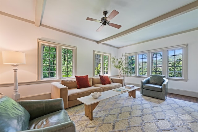 66 Fox Trot Ln, Tryon, NC 28782 - living area with beam ceiling, healthy amount of natural light, ceiling fan, and wood finished floors
