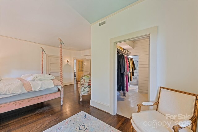 66 Fox Trot Ln, Tryon, NC 28782 - bedroom with dark wood finished floors, a walk in closet, ornamental molding, and a closet
