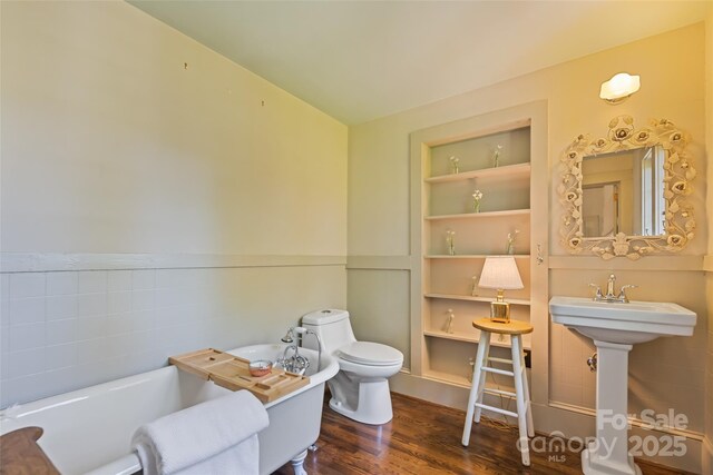 66 Fox Trot Ln, Tryon, NC 28782 - full bath with a tub, built in features, and wood finished floors