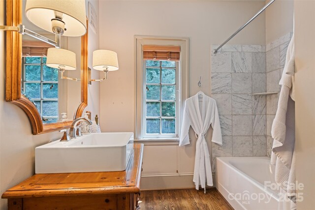 66 Fox Trot Ln, Tryon, NC 28782 - bathroom featuring wood finished floors, vanity, and shower / bath combo