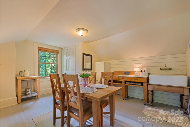 66 Fox Trot Ln, Tryon, NC 28782 - dining space featuring vaulted ceiling and wood finished floors
