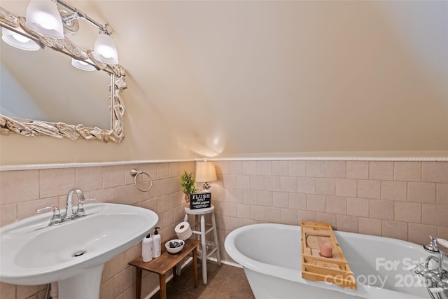 66 Fox Trot Ln, Tryon, NC 28782 - full bathroom featuring a soaking tub, tile patterned floors, and tile walls