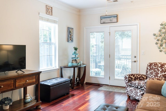 entryway with dark wood-style flooring and crown molding