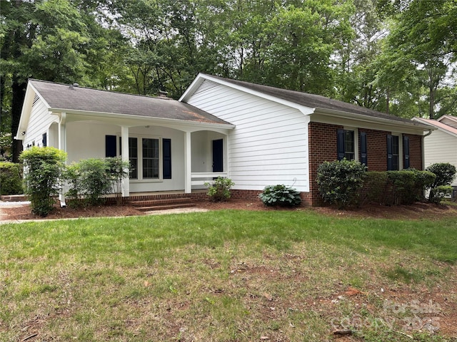 7212 Bradley Ct, Charlotte, NC 28227 - ranch-style home with a porch, a front lawn, and a shingled roof