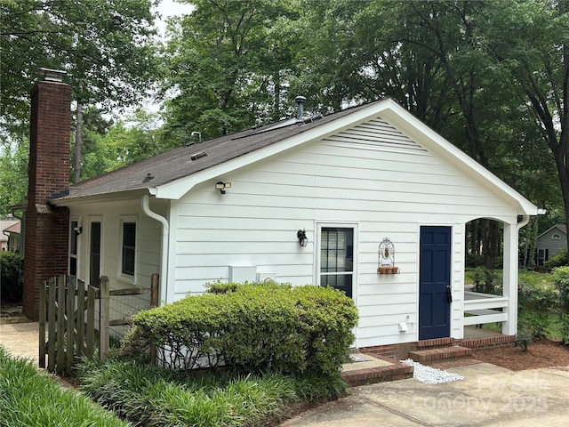 7212 Bradley Ct, Charlotte, NC 28227 - view of front of home with a chimney and roof with shingles