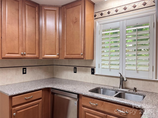 7212 Bradley Ct, Charlotte, NC 28227 - kitchen with dishwasher, a sink, decorative backsplash, and brown cabinetry