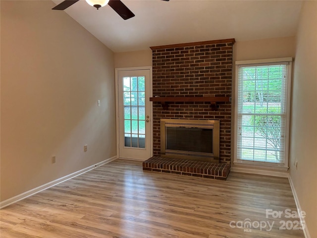7212 Bradley Ct, Charlotte, NC 28227 - unfurnished living room featuring a ceiling fan, healthy amount of natural light, baseboards, wood finished floors, and vaulted ceiling