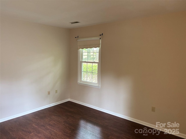 7212 Bradley Ct, Charlotte, NC 28227 - spare room with dark wood-style floors and baseboards