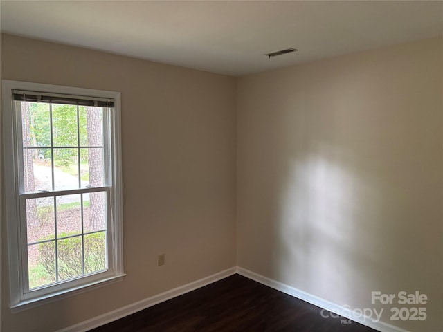 7212 Bradley Ct, Charlotte, NC 28227 - unfurnished room with baseboards and dark wood finished floors