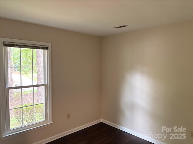 7212 Bradley Ct, Charlotte, NC 28227 - empty room featuring baseboards and dark wood-style floors