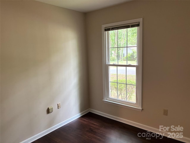 7212 Bradley Ct, Charlotte, NC 28227 - unfurnished room featuring healthy amount of natural light, baseboards, and dark wood-type flooring