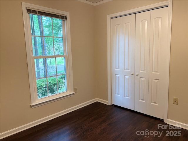 7212 Bradley Ct, Charlotte, NC 28227 - unfurnished bedroom with baseboards, dark wood-type flooring, and multiple windows