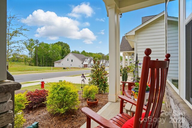 1318 Encore Ln, Waxhaw, NC 28173 - view of patio featuring covered porch and a residential view