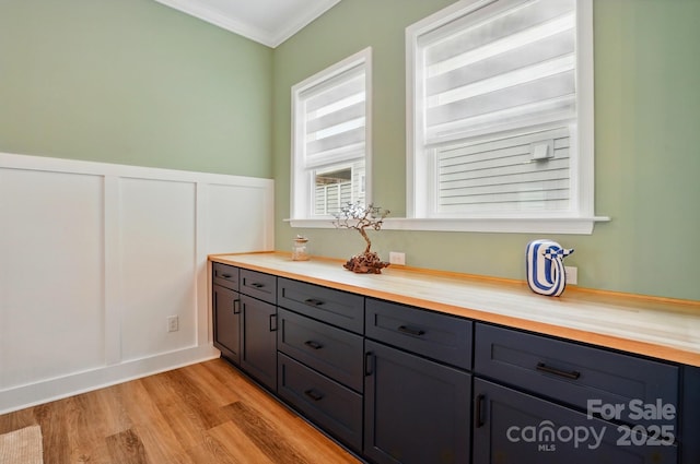 1318 Encore Ln, Waxhaw, NC 28173 - bathroom featuring ornamental molding, wood finished floors, vanity, and a wainscoted wall
