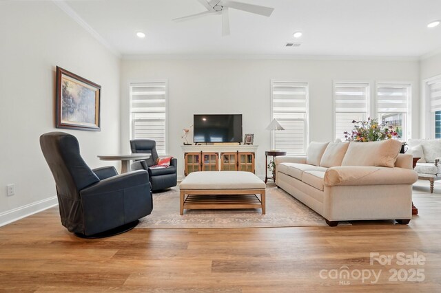 1318 Encore Ln, Waxhaw, NC 28173 - living room with crown molding, wood finished floors, a ceiling fan, baseboards, and recessed lighting