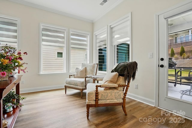 1318 Encore Ln, Waxhaw, NC 28173 - sitting room featuring ornamental molding, wood finished floors, plenty of natural light, and baseboards