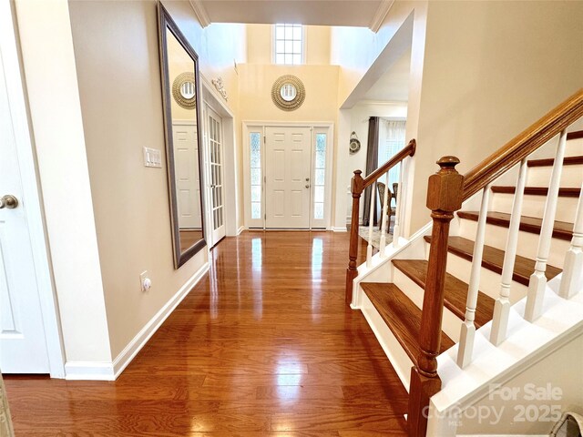 16012 Caranna Ct, Charlotte, NC 28277 - entryway with wood finished floors, stairway, and baseboards
