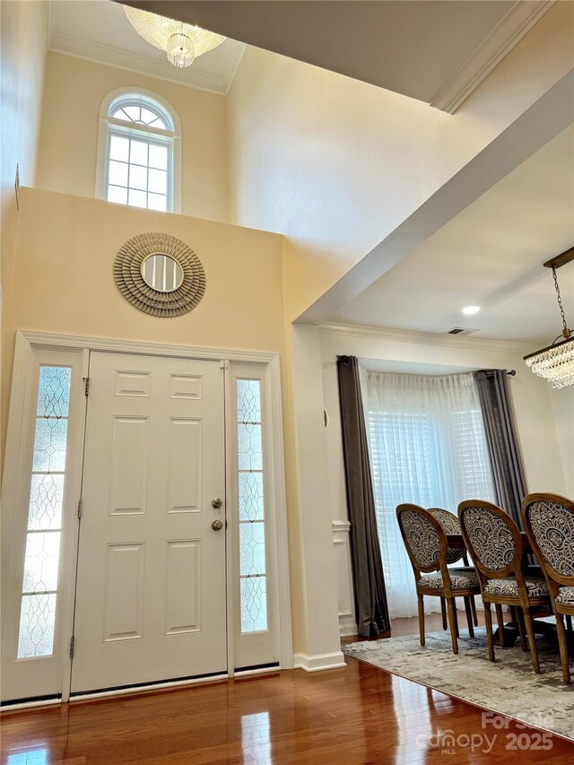 16012 Caranna Ct, Charlotte, NC 28277 - entrance foyer with crown molding, a chandelier, wood finished floors, baseboards, and recessed lighting