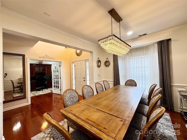 16012 Caranna Ct, Charlotte, NC 28277 - dining space with ornamental molding, wood finished floors, a chandelier, and wainscoting
