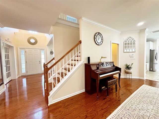 16012 Caranna Ct, Charlotte, NC 28277 - foyer featuring crown molding, stairway, baseboards, and wood finished floors