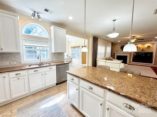 16012 Caranna Ct, Charlotte, NC 28277 - kitchen featuring dishwasher, a sink, light stone counters, decorative backsplash, and open floor plan