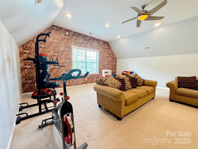 16012 Caranna Ct, Charlotte, NC 28277 - exercise room featuring brick wall, vaulted ceiling, baseboards, carpet flooring, and a ceiling fan