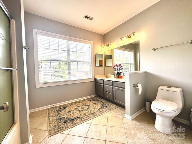 16012 Caranna Ct, Charlotte, NC 28277 - full bath featuring toilet, healthy amount of natural light, vanity, and tile patterned flooring