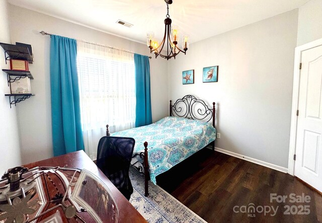 16012 Caranna Ct, Charlotte, NC 28277 - bedroom featuring a chandelier, wood finished floors, and baseboards