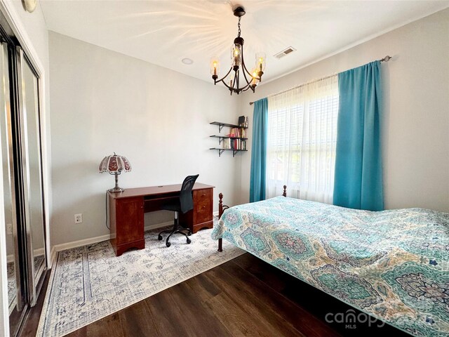 16012 Caranna Ct, Charlotte, NC 28277 - bedroom with a chandelier, wood finished floors, baseboards, and a closet