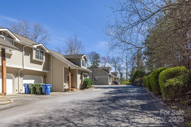 445 Sand Hill Rd Unit 1-6, Asheville, NC 28806 - view of side of property featuring asphalt driveway and a garage